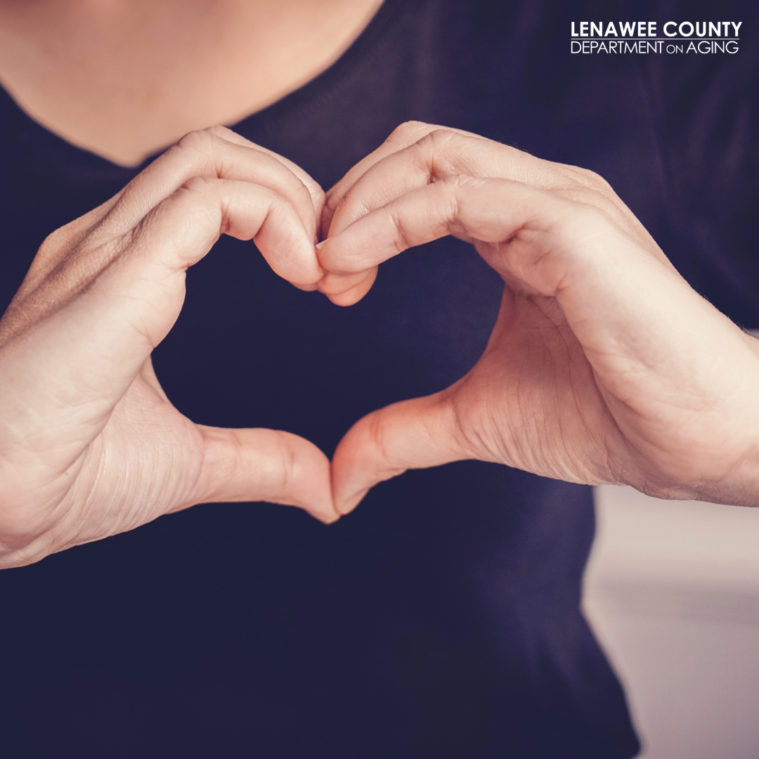 person with heart over heart